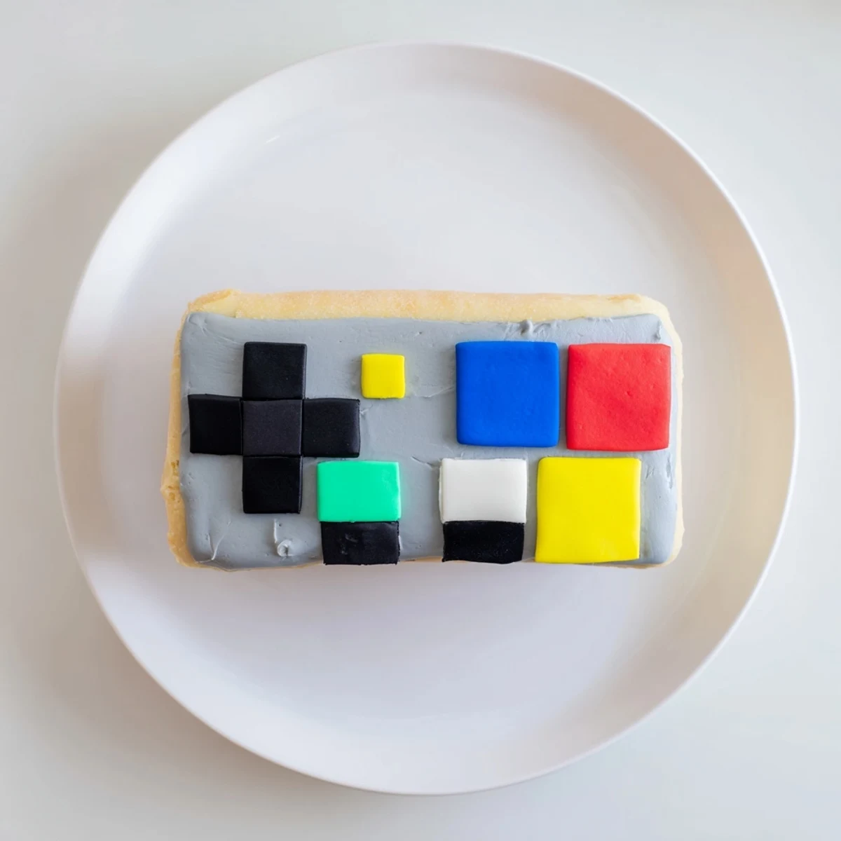 This homemade pixel video game controller cake shows a visually exciting treat, ideal for any party.