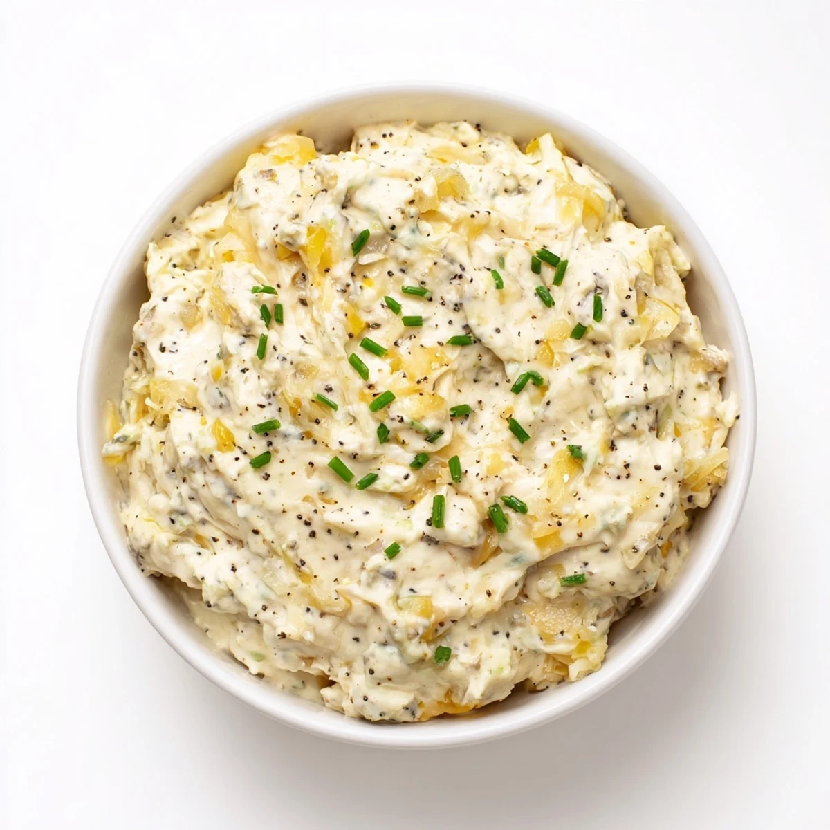 Crispy potato chips alongside creamy homemade onion dip, a perfect party food pairing.