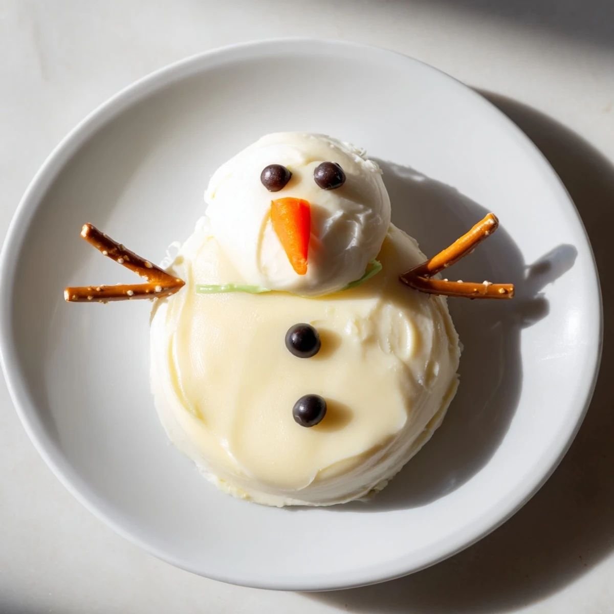 Check out these adorable Melted Snowman Cheese Bites, perfect for holiday parties with delightful cheese flavors.