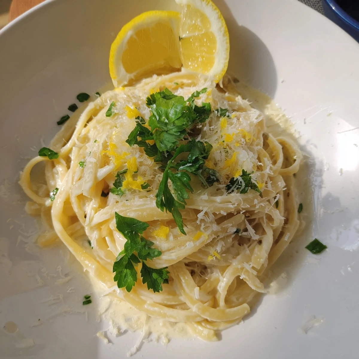 Tangled strands of Lemon-Garlic Greek Yogurt Pasta, coated in a luscious, lemon-infused sauce, delicious.