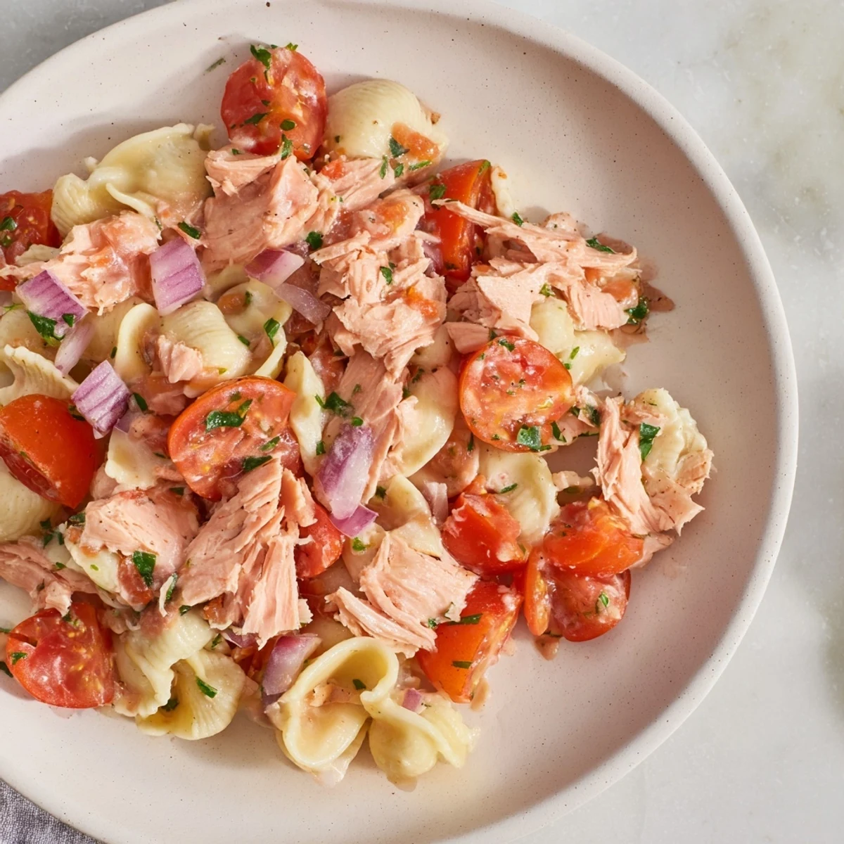 Flaky tuna and tender chickpeas in a zesty lemon dressing: enjoying homemade Dense Chickpea and Tuna Salad.
