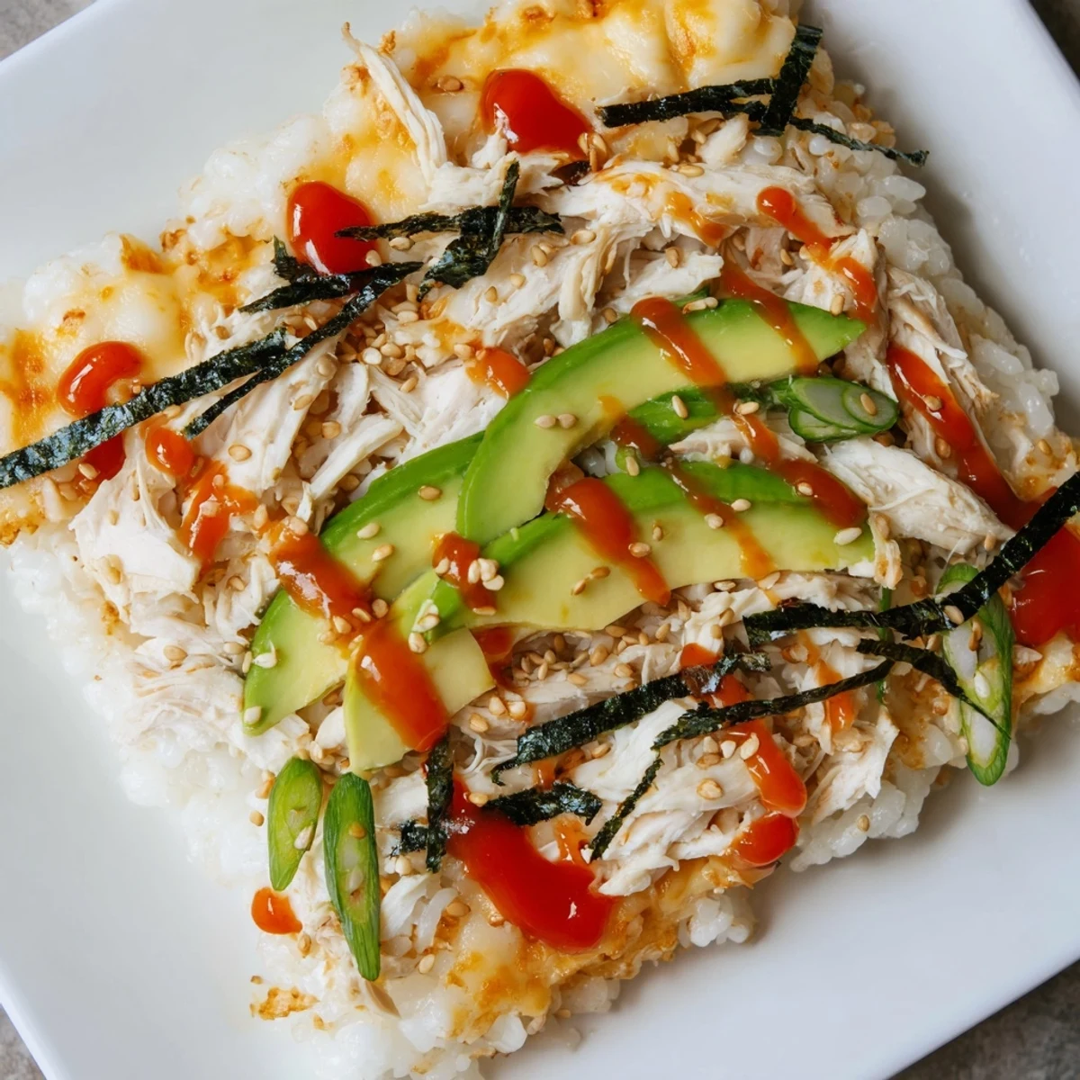Savory Chicken Sushi Bake; creamy layers of rice, chicken, and toppings, perfect for dinner.