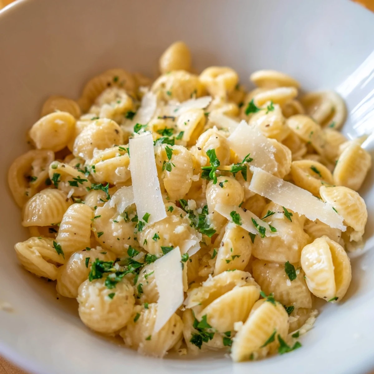 Creamy ditalini pasta glistening, coated in garlicky sauce, a comforting vegetarian dinner option.
