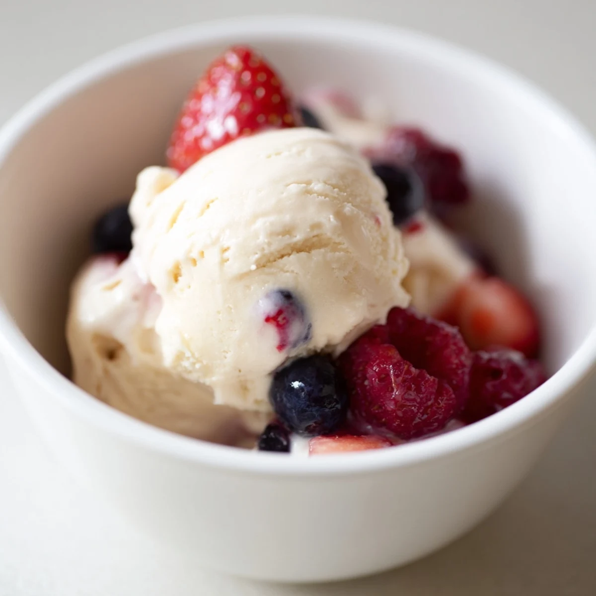 A view of Cottage Cheese Ice Cream, swirled with berries, creating a vibrant, cool dessert.