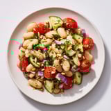 A bright bowl of the fresh Hearty White Bean and Lemon Salad, perfectly seasoned with lemon vinaigrette.