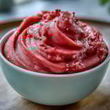 A glossy, thick guava paste shows a smooth texture after slow cooking and careful straining.