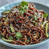Cold soba noodle salad with zesty sesame ginger dressing, a light, flavorful meal.