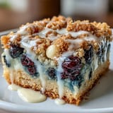 Freshly baked white chocolate lemon blueberry blondies, bursting with berries and citrus zest.