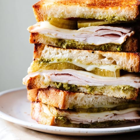 Golden, melty Pesto Turkey Zucchini Grilled Cheese stacks are ready to serve with crispy edges and warm insides.