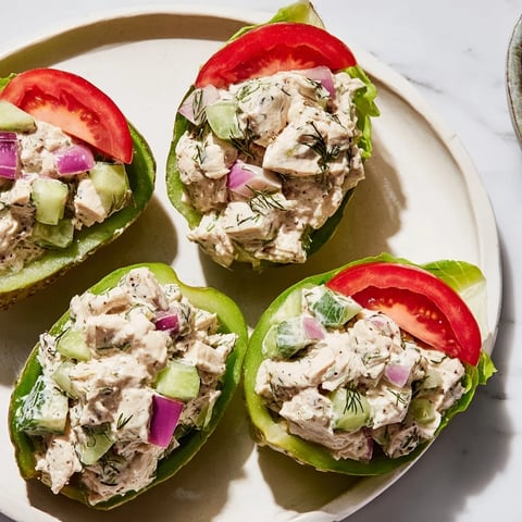 Juicy chicken salad overflows from tangy pickle halves, creating a delicious Pickle Sandwich.