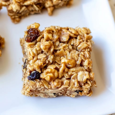 Golden, baked maple cinnamon oatmeal bars, easy breakfast treats with a delightful aroma.