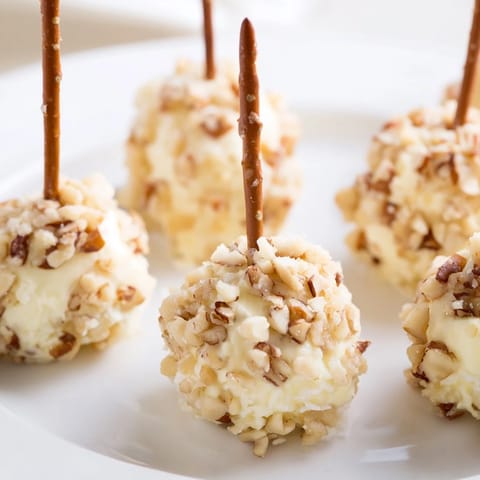 Golden Champagne Cork Cheese Balls displayed on a platter, perfect for a celebration or gathering.