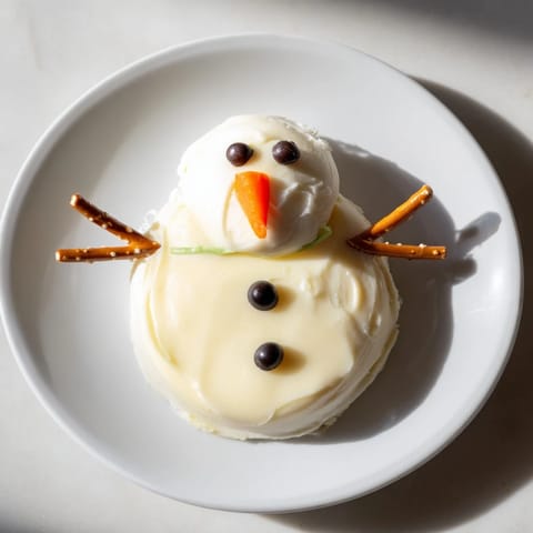 Check out these adorable Melted Snowman Cheese Bites, perfect for holiday parties with delightful cheese flavors.