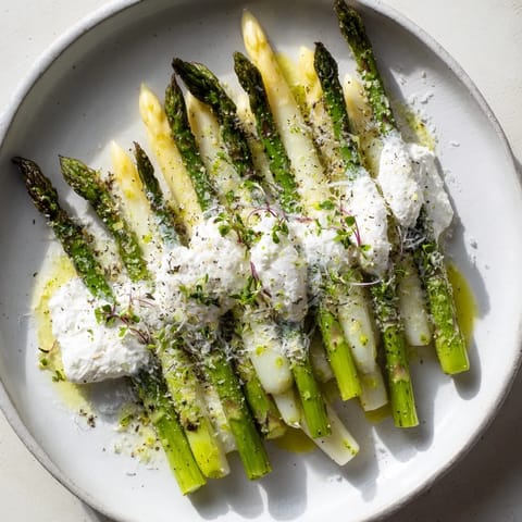 Close-up of The Silver Birch featuring delicate white asparagus artfully arranged with cheese and truffle.