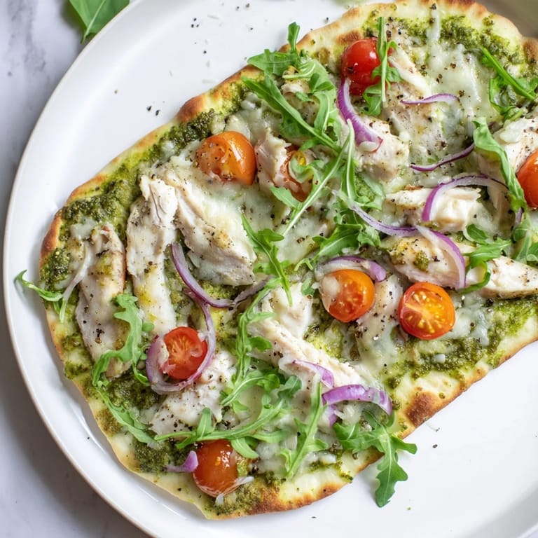 Homemade Pesto Chicken Flatbread, a quick and easy recipe perfect for a weeknight dinner.